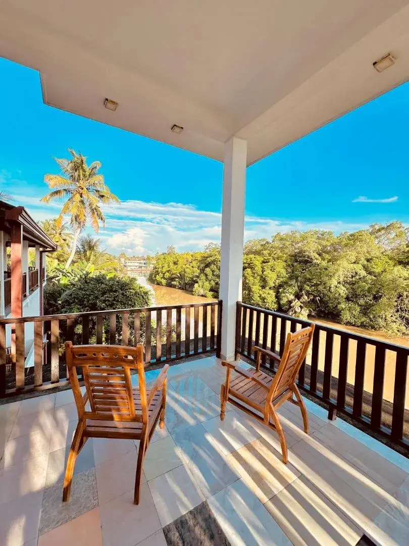 Balcony with chairs overlooking the river