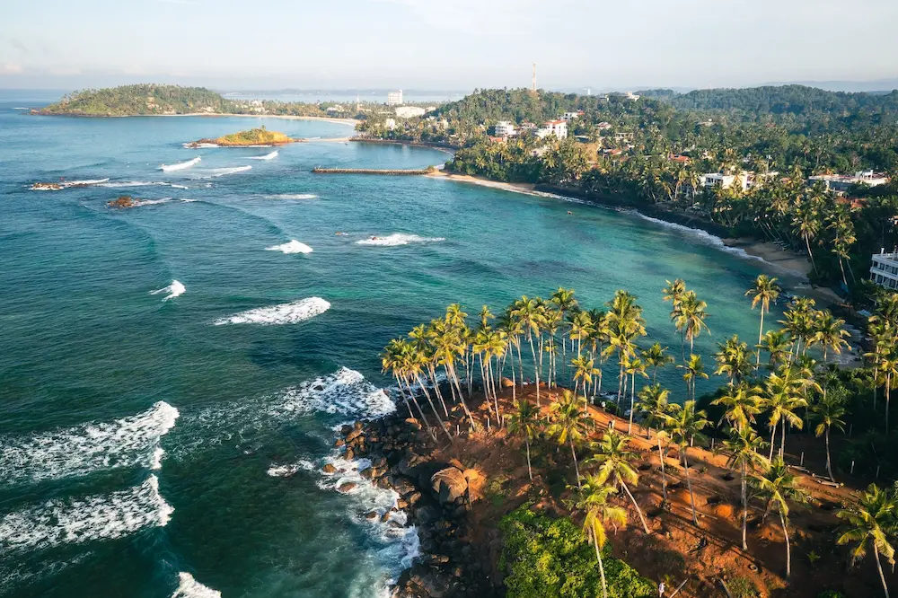 Aerial view of the palm-lined south coast of Sri Lanka near Weligama